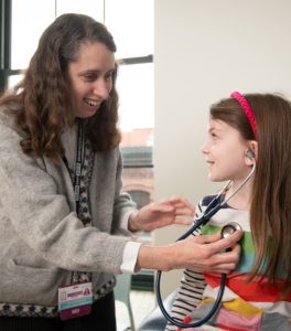 dr. cara marshall working with patient